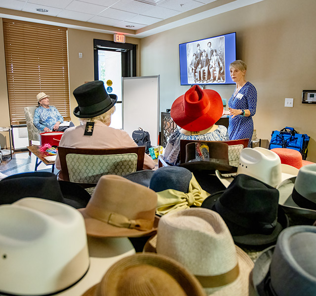 A class on British hats full of residents.