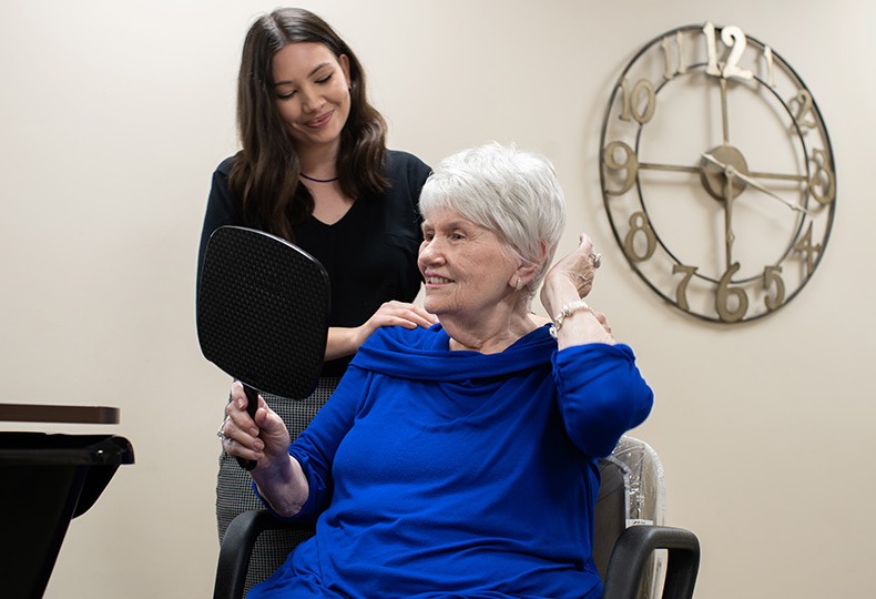 A resident getting their hair done at the salon.
