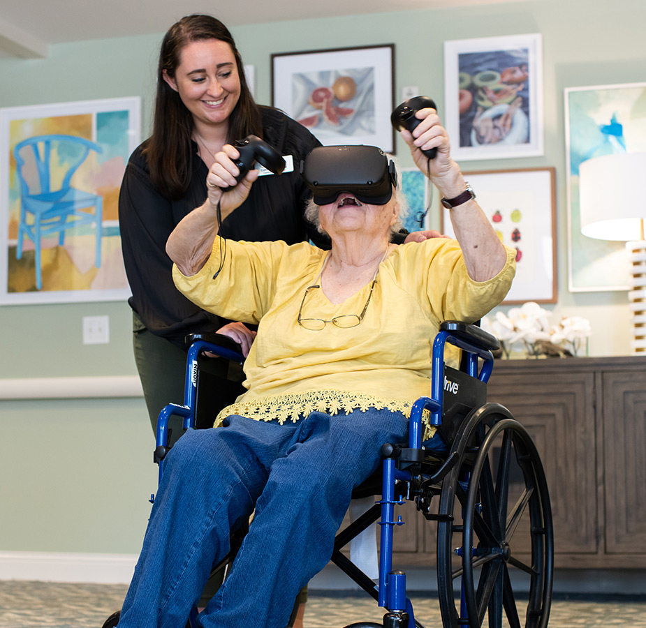 A resident playing with a VR set.
