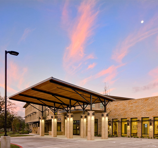The building exterior at sunset.
