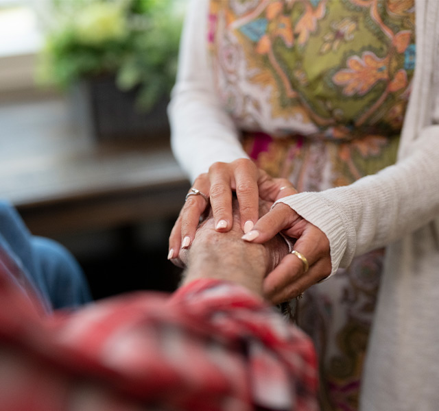 Two people holding hands.