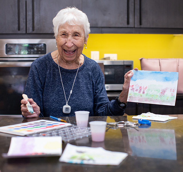 A resident is showcasing her art work.