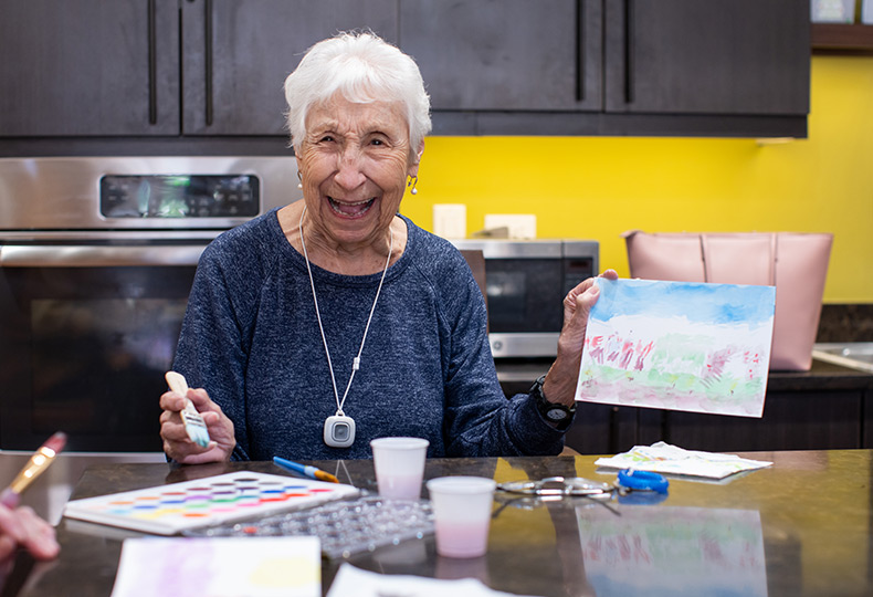 A resident is showcasing her art work.