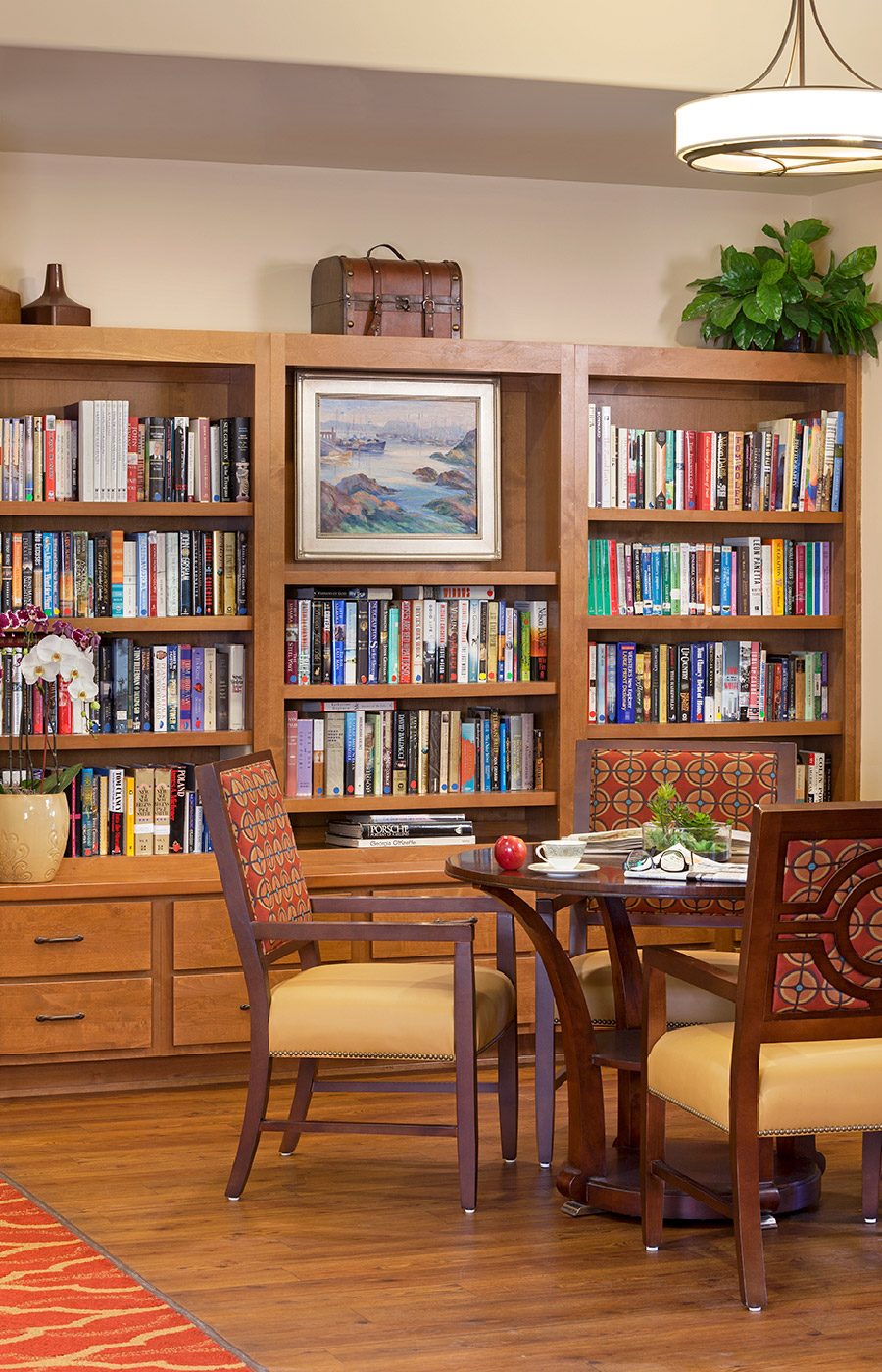 A large bookshelf area with a dining table