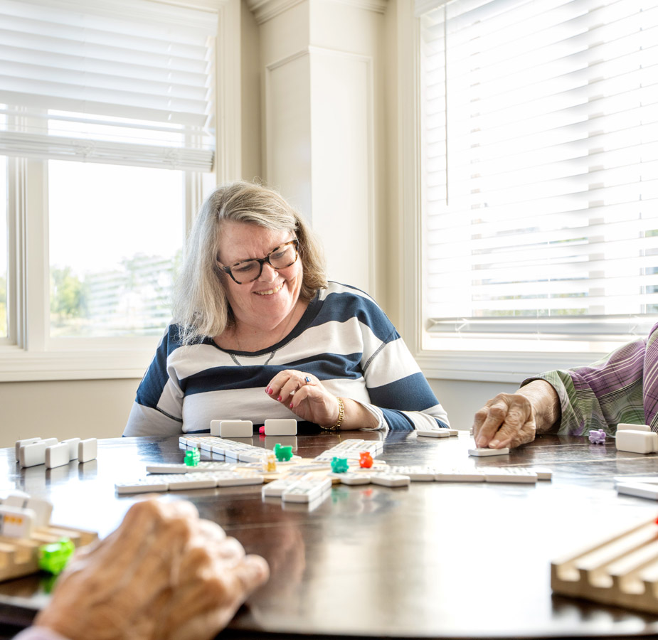 Two residents are playing dominoes.