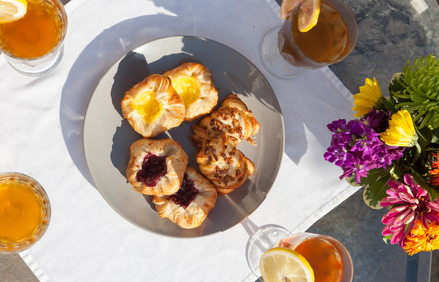 Drinks and pastries on a table.