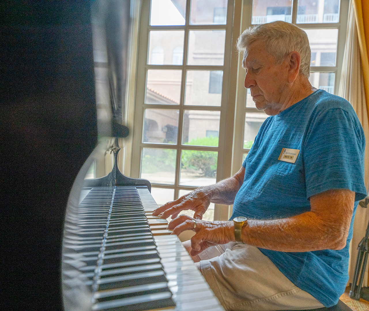 A resident is playing a piano.