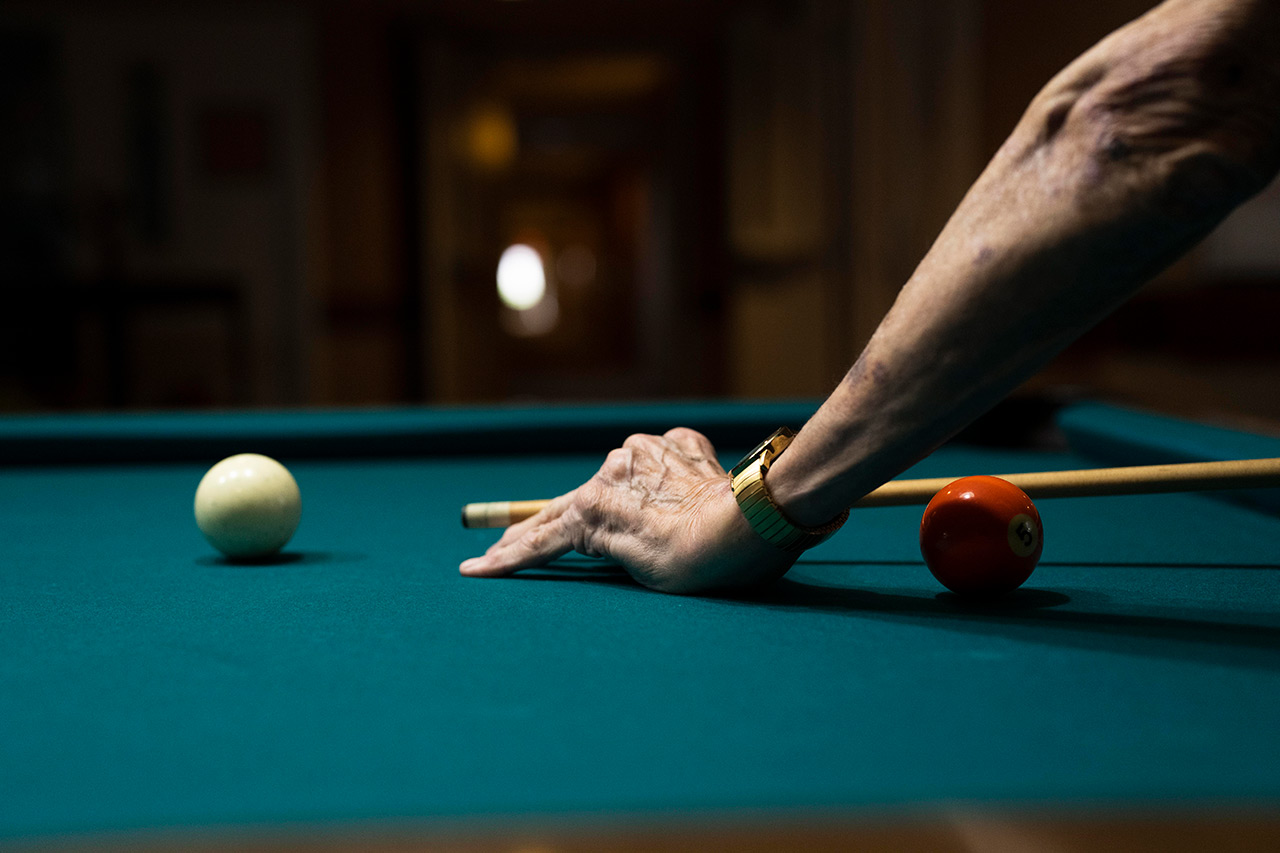 A person is playing pool.