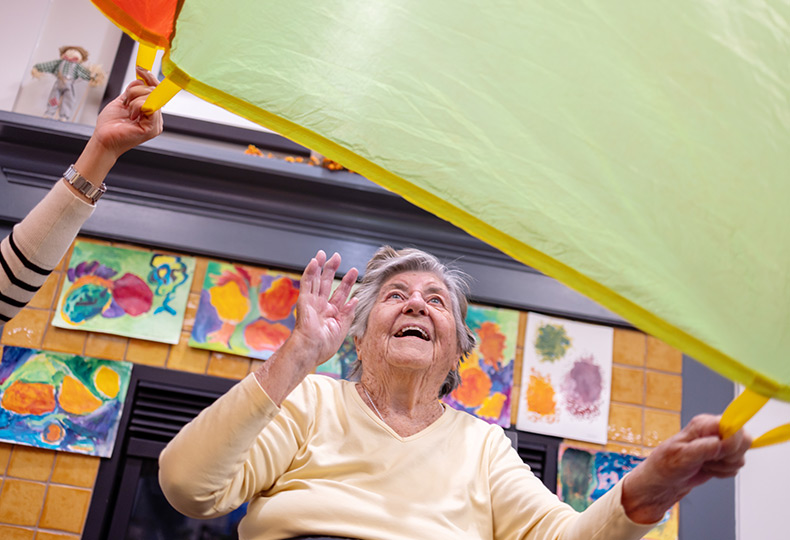 A person playing with a parachute.