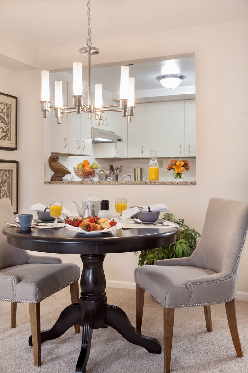 Dining table with seating area in apartment.