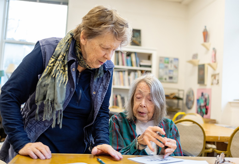 Two people in the art room.