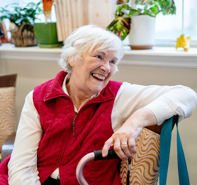 A person sitting and smiling.