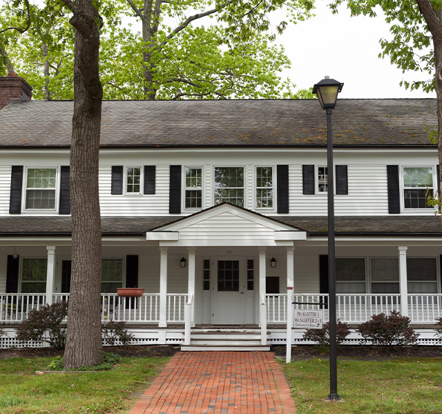 A house with a wrap around porch.
