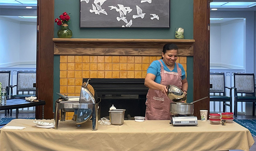 A person cooking at a table.