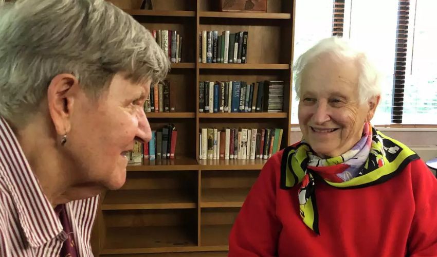 Margaret and Lucy in a library.