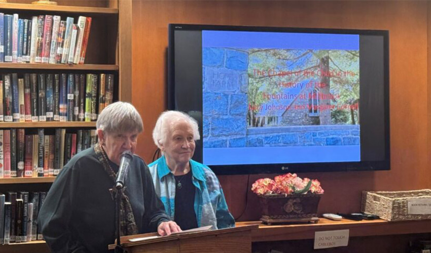 Two people giving presentation.