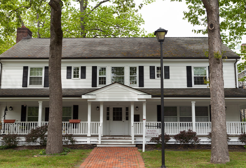 A house with a wrap around porch.