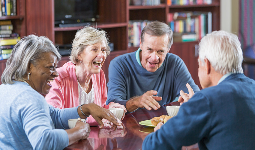 A group of seniors having coffee.