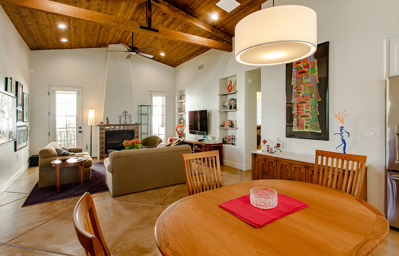 Seating area with sofas, chairs, and tables.