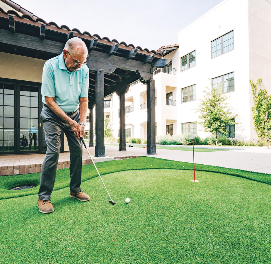 A resident playing golf.
