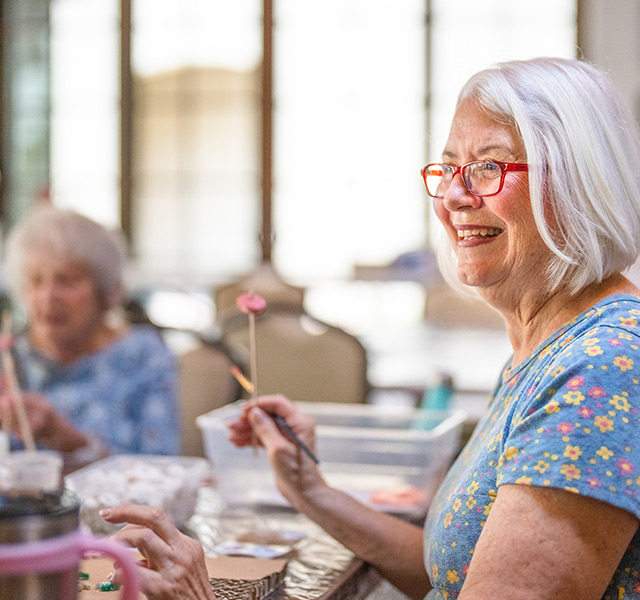 People painting in a class.