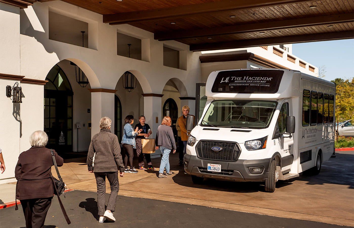 People loading into a bus.
