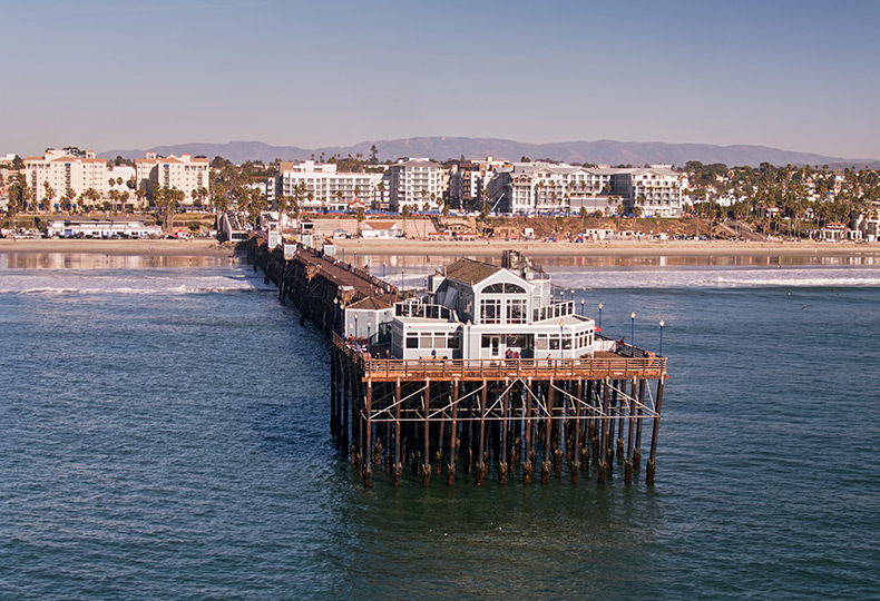 A pier jutting out into the ocean.