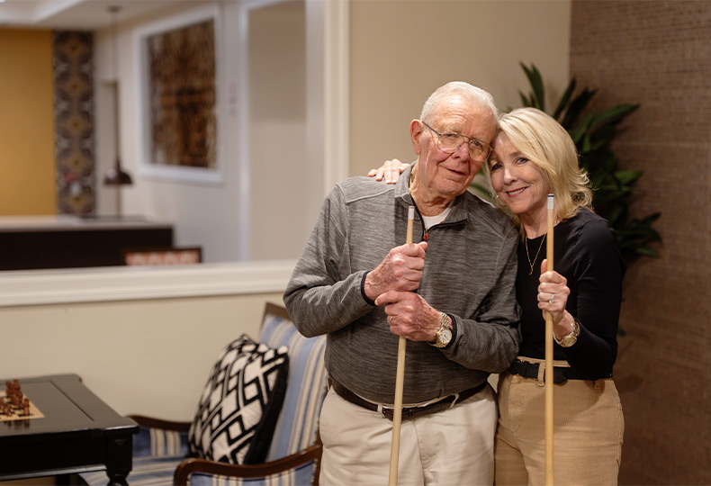 Two people playing pool.