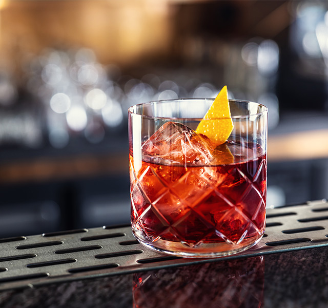 A cocktail on a counter.