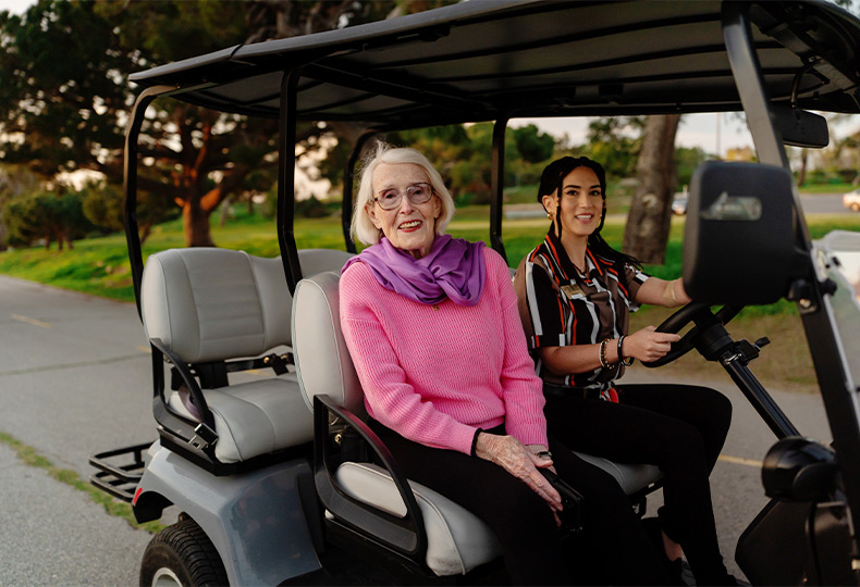 People in a golf cart.