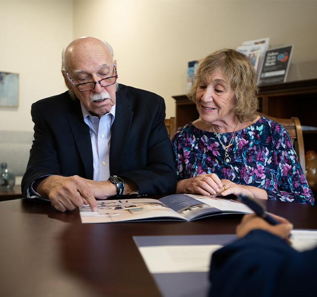 Two people sitting in an office.