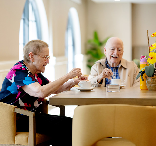 Two people enjoying coffee together.