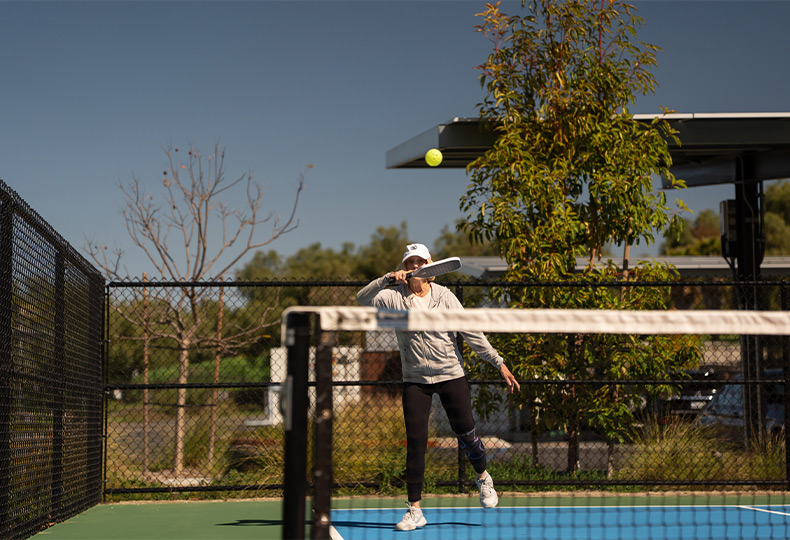 A person playing pickleball.