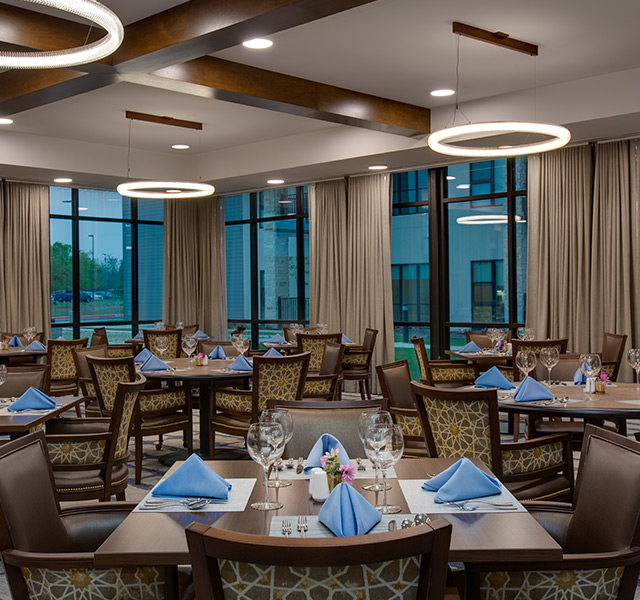 A dining room set for dinner.