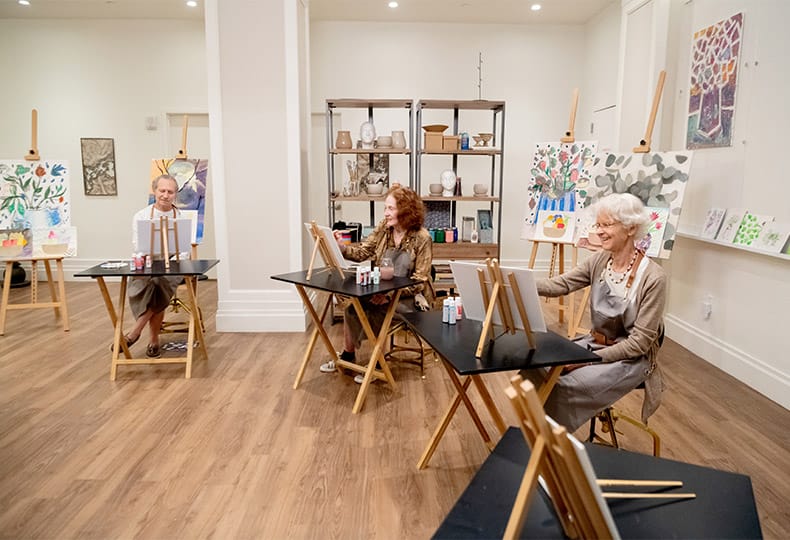 Residents enjoying an art activity.