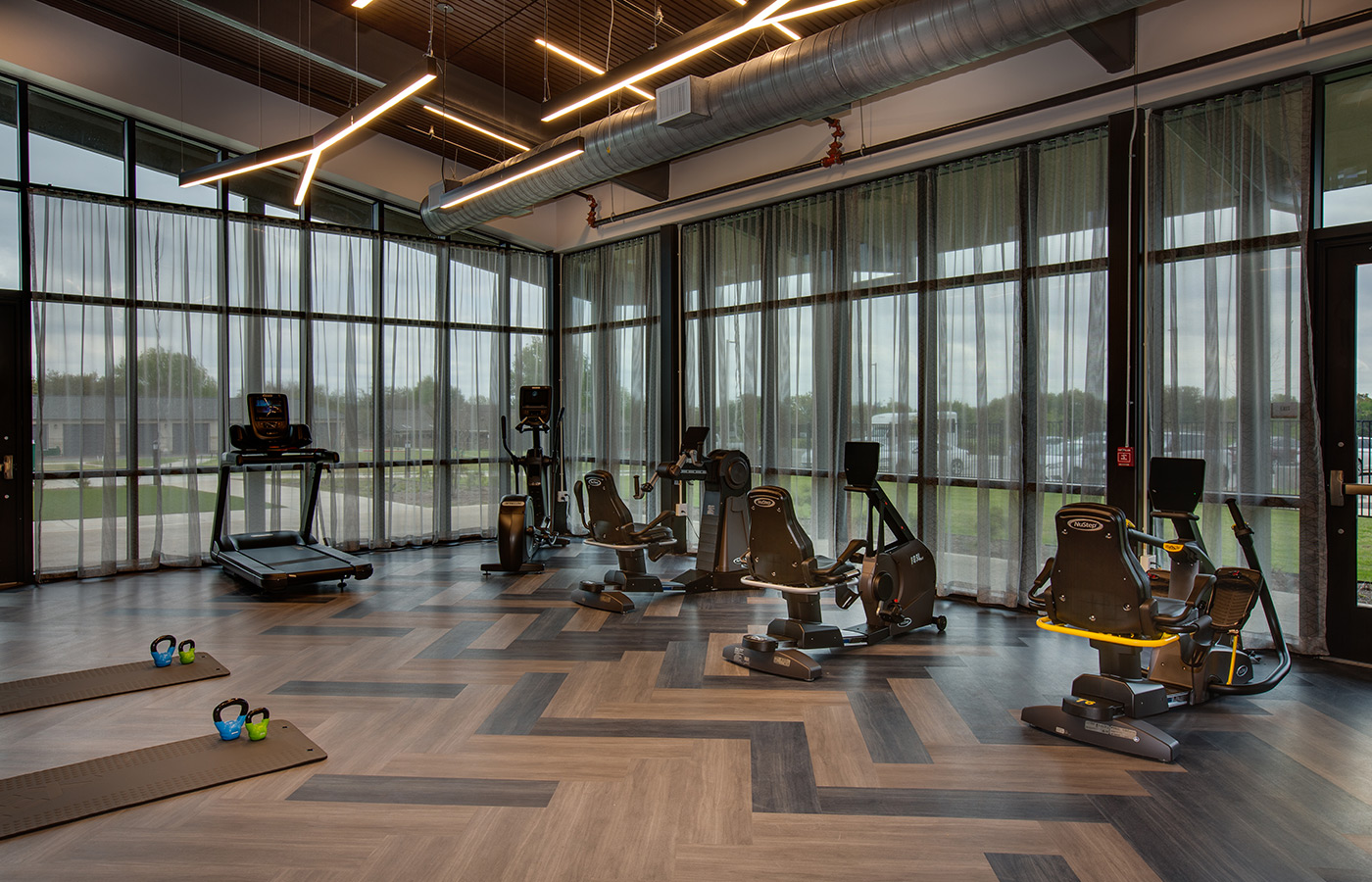 A fitness center with gym equipment.