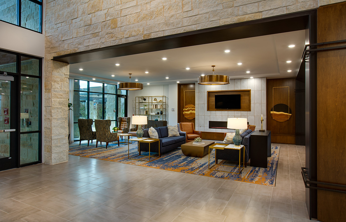 The lobby with seating and a fireplace.