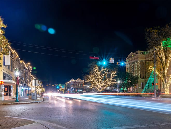 Long exposure of lights with car passing by.