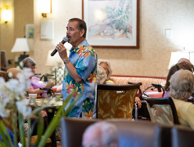 A person speaking to a crowd.