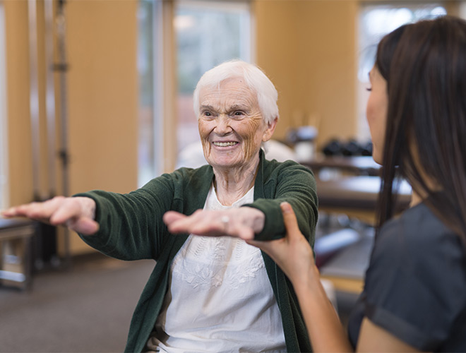 A person working with a physical trainer.