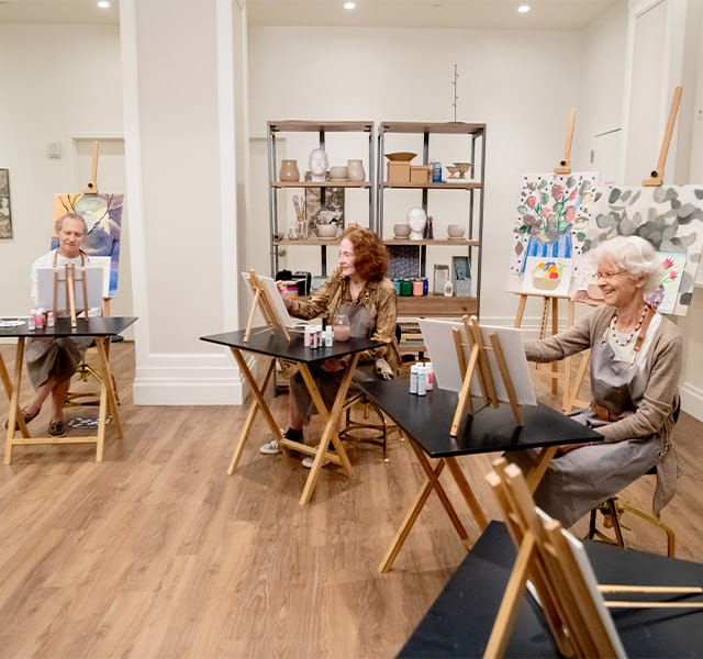 Residents enjoying an art activity.