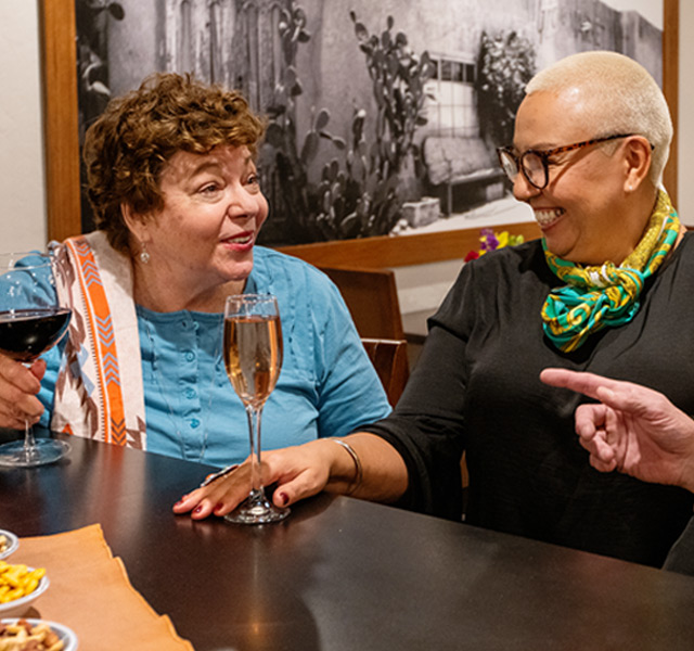 Residents enjoying wine.
