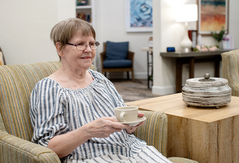 A person drinking coffee.