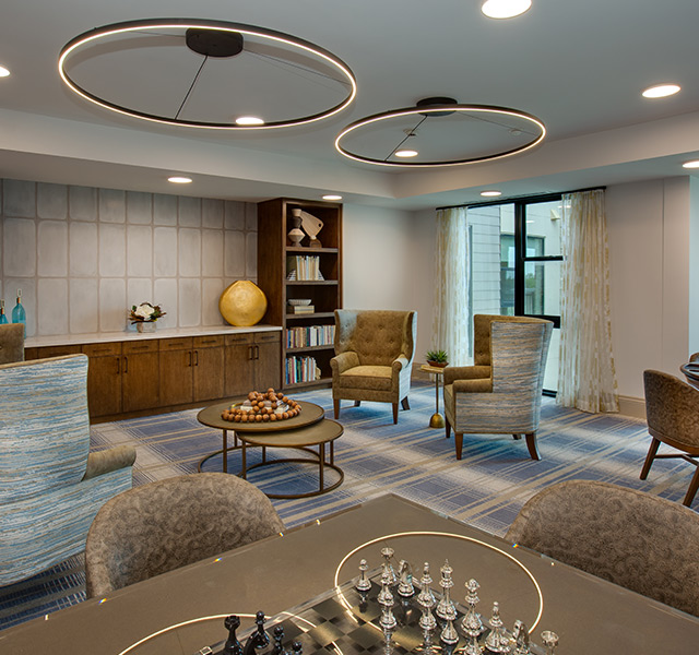 An activity room with seating and tables.