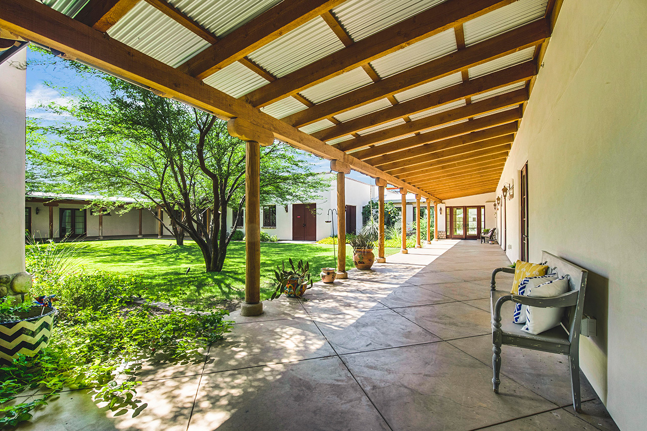 The Hacienda at the River exterior building and courtyard. 