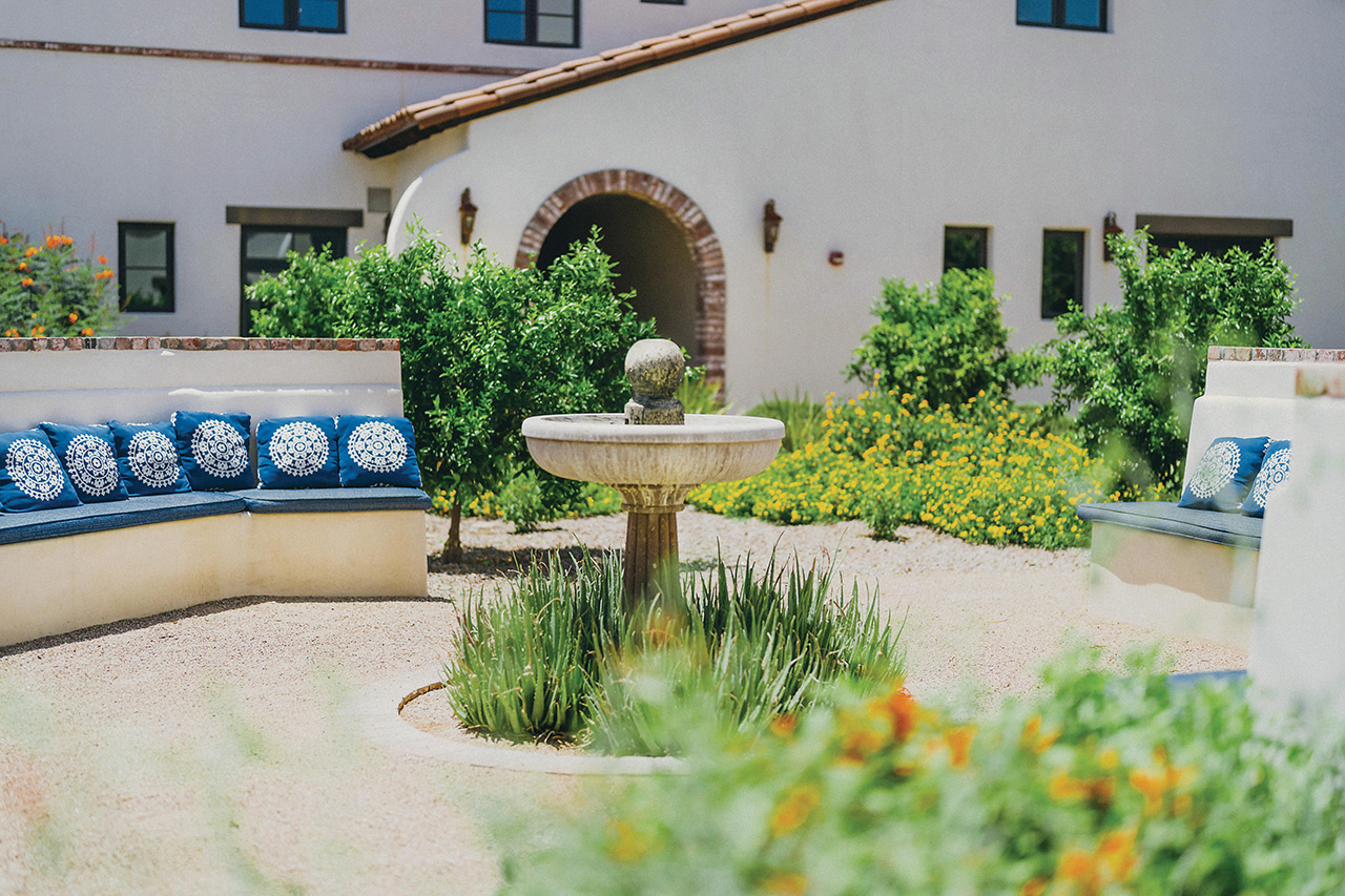 The Hacienda at the River exterior building and courtyard. 