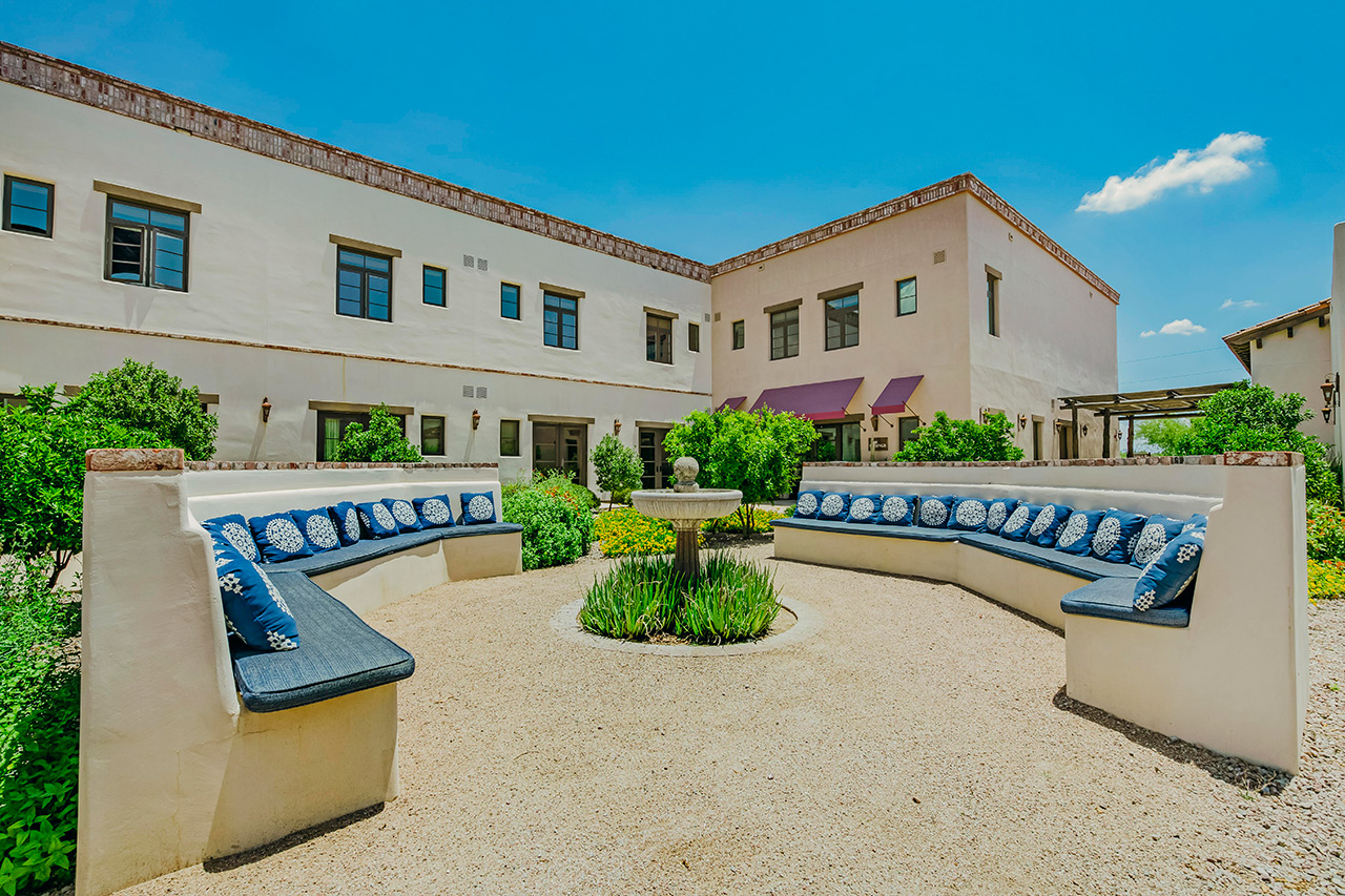 The Hacienda at the River exterior building and courtyard. 