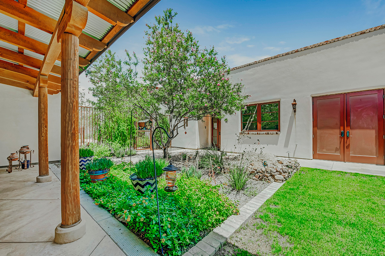 The Hacienda at the River exterior building and courtyard. 