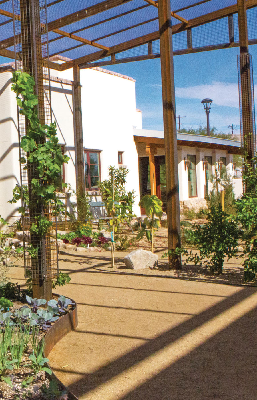 The Hacienda at the River exterior building and courtyard. 
