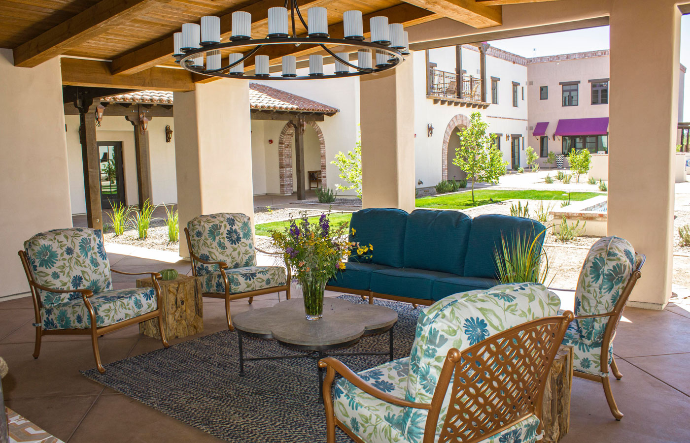 The Hacienda at the River exterior building and courtyard and seating area.